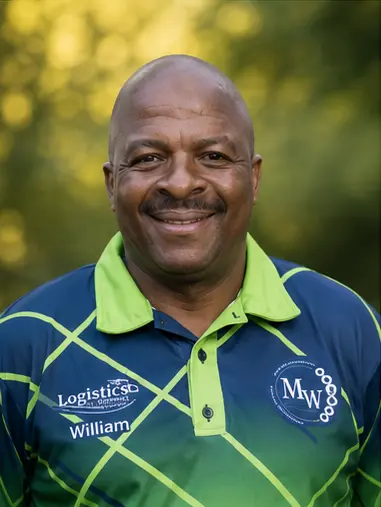 MetsonWorld Logistics driver in a branded blue and green shirt