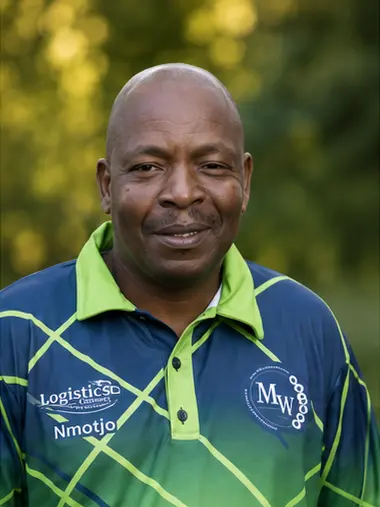 MetsonWorld Logistics driver in a branded blue and green shirt